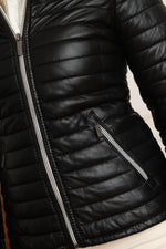 Quilted lambskin jacket in deep black, white zip and statement collar. - Image n°3