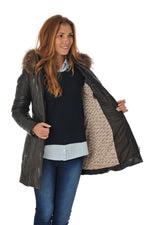 Reddish-brown lambskin coat with quilted warmth and fur-trimmed hood. - Image n°4
