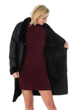 Reversible black lambshearling coat, sleek or fur-lined. Winter warmth - Image n°11