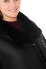Reversible black lambshearling coat, sleek or fur-lined. Winter warmth - Image n°9