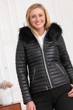 Black sheepskin jacket with glossy quilted look. Racoon fur hood trim. - Image n°3