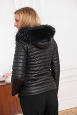 Black sheepskin jacket with glossy quilted look. Racoon fur hood trim. - Image n°5