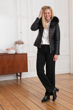 Black sheepskin jacket with glossy quilted look. Racoon fur hood trim. - Image n°2