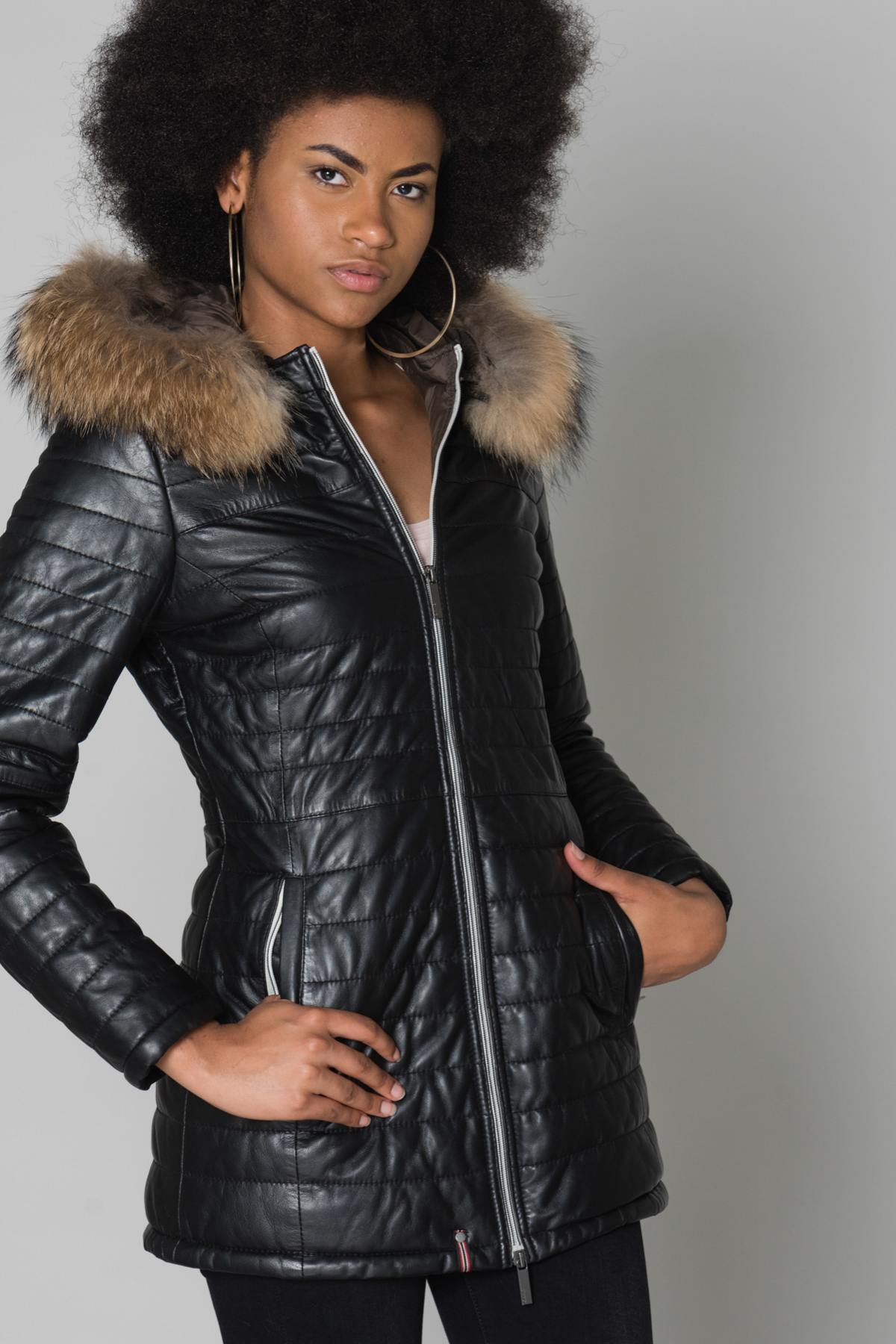 Black shearling jacket with fur-trimmed hood and Thinsulate lining. - Image n°1