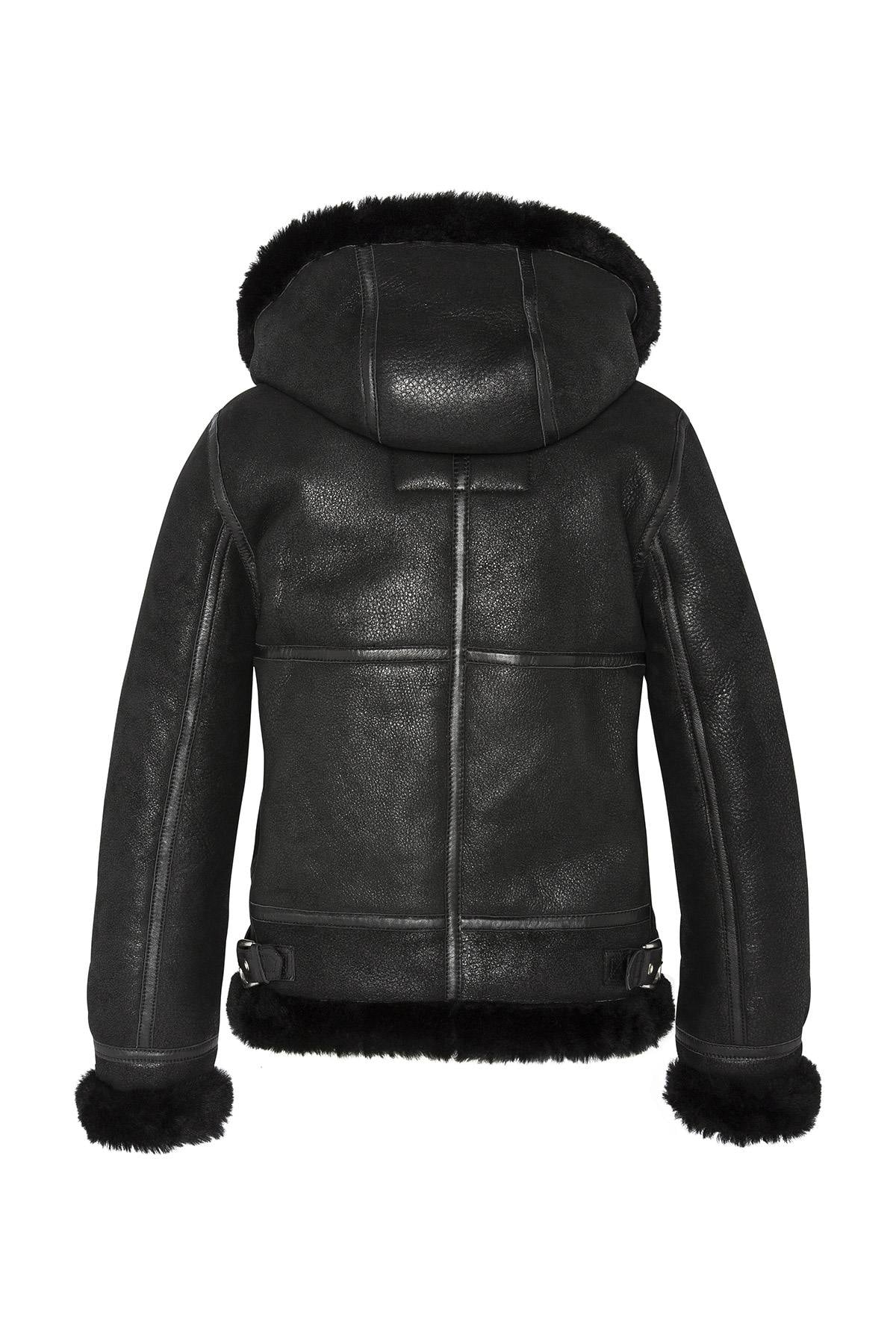 A fitted sheepskin bomber by Schott, lined with fur for winter warmth. - Image n°4