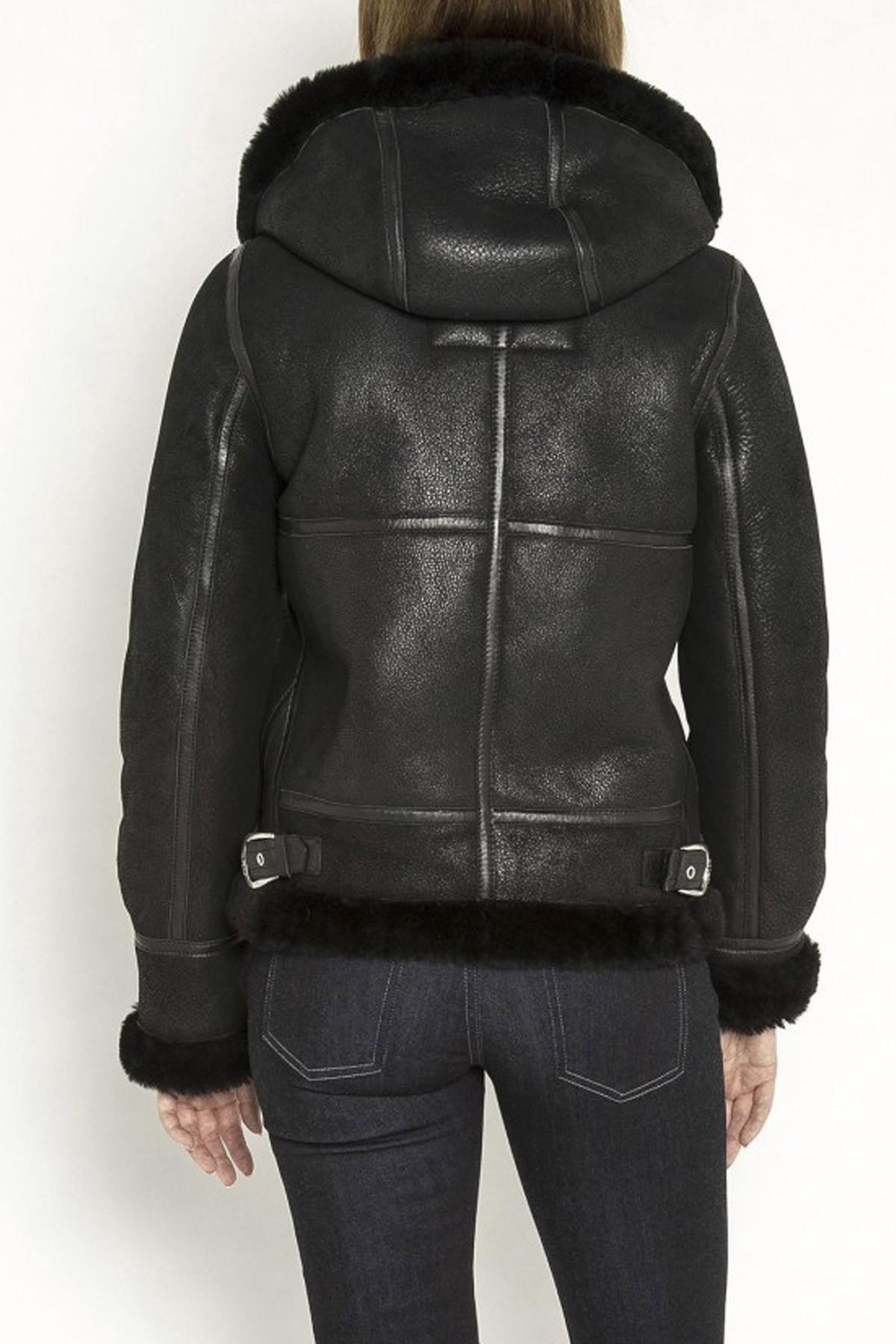 A fitted sheepskin bomber by Schott, lined with fur for winter warmth. - Image n°9