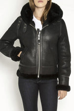 A fitted sheepskin bomber by Schott, lined with fur for winter warmth. - Image n°6