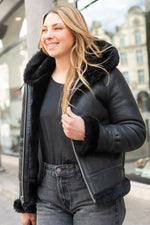 A fitted sheepskin bomber by Schott, lined with fur for winter warmth. - Image n°5