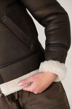 Dark brown sheepskin bomber by Schott. Warm, textured, slim-fit. - Image n°8