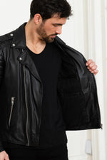 Black lambskin biker jacket with quilted shoulders and asymmetric zip. - Image n°14