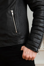 Black lambskin biker jacket with quilted shoulders and asymmetric zip. - Image n°8