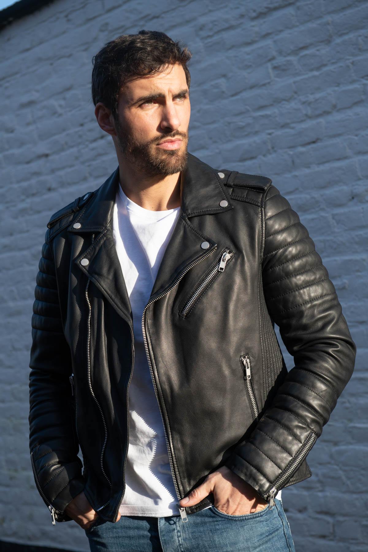 Black lambskin biker jacket with quilted shoulders and asymmetric zip. - Image n°1