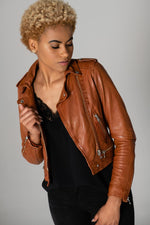 Distressed cognac lambskin biker jacket, cropped with silver details. - Image n°1