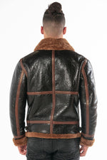 Oiled black sheepskin bomber with cognac shearling lining. - Image n°4