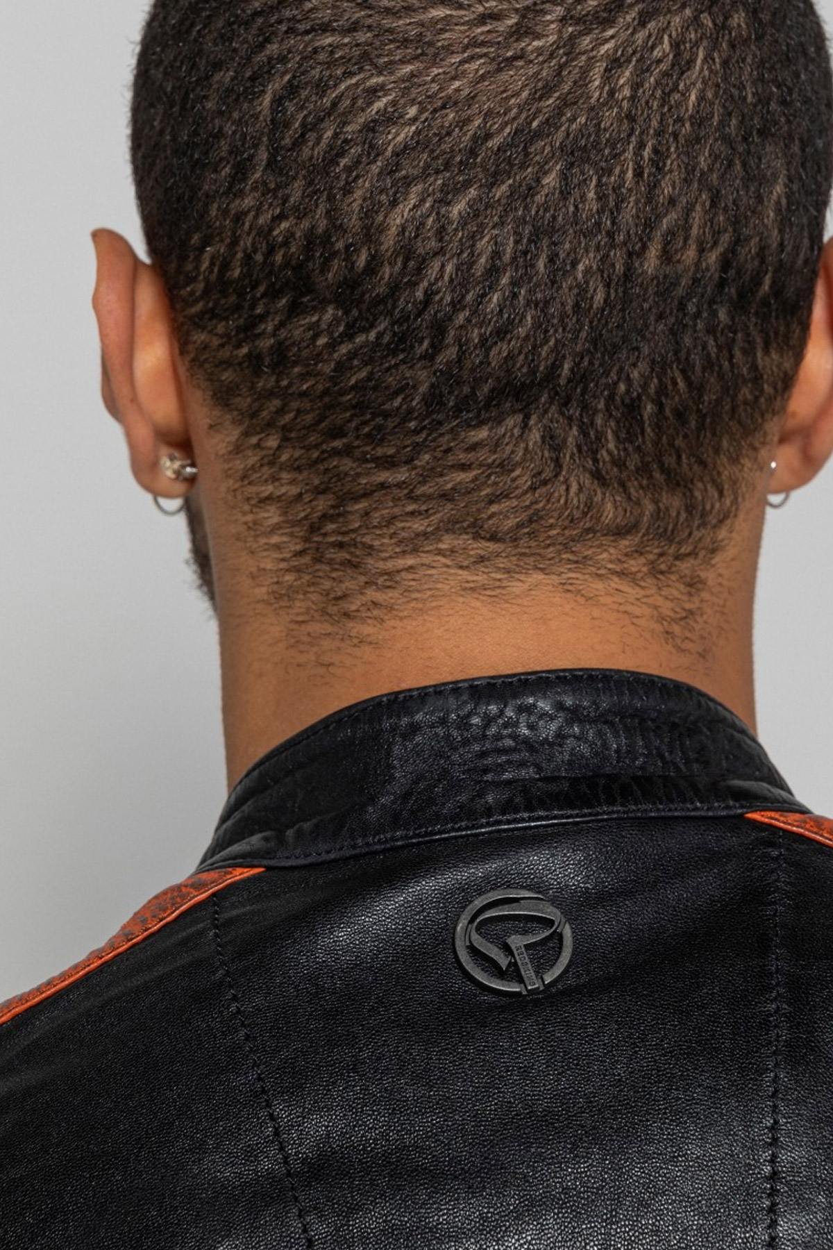 Black lambskin biker jacket with bold orange accents. Slim and sharp. - Image n°6