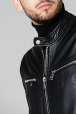 Slim black lambskin jacket with zippered cuffs and burgundy lining. - Image n°4