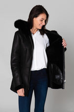 Warm black reversed sheepskin coat with fixed hood and straight fit. - Image n°5