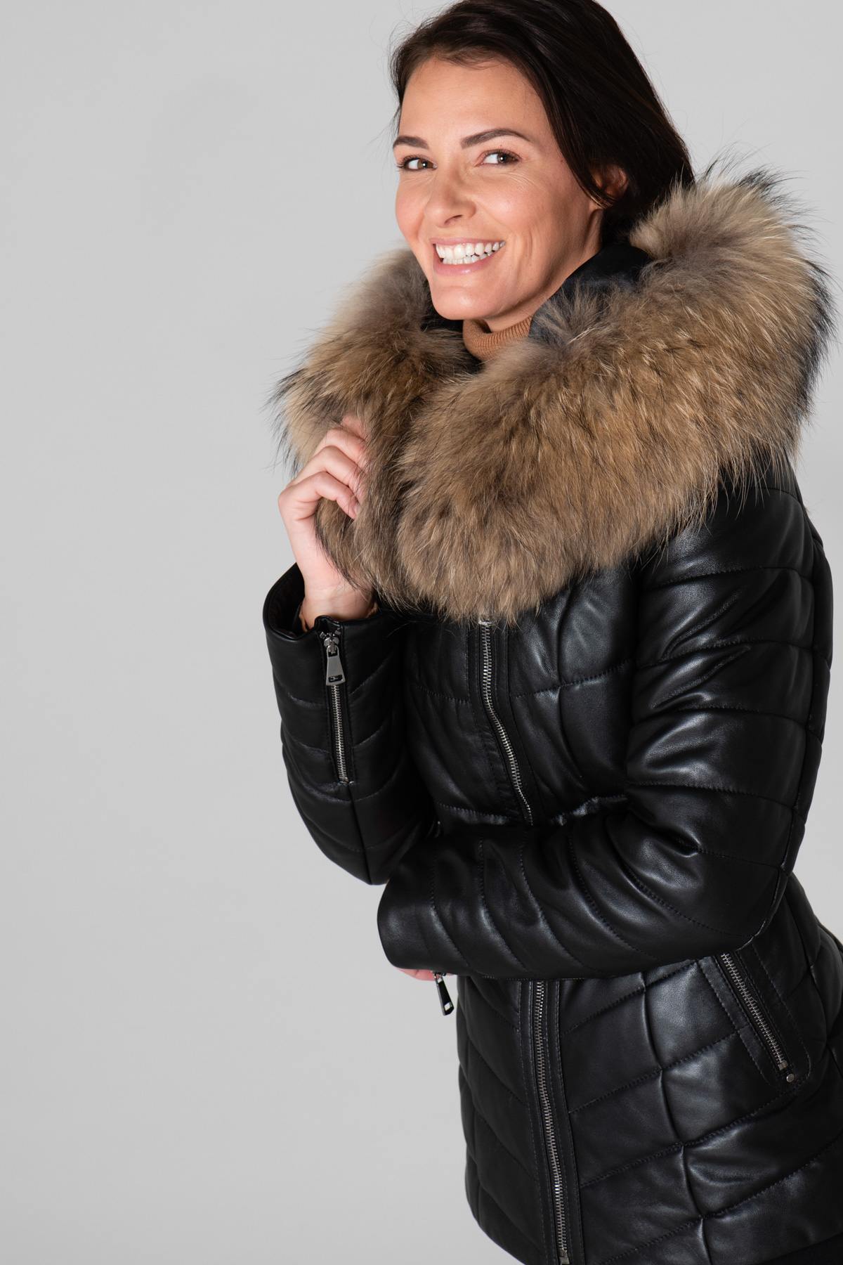 Black lambskin jacket, mid-length with genuine shearling for warmth. - Image n°1