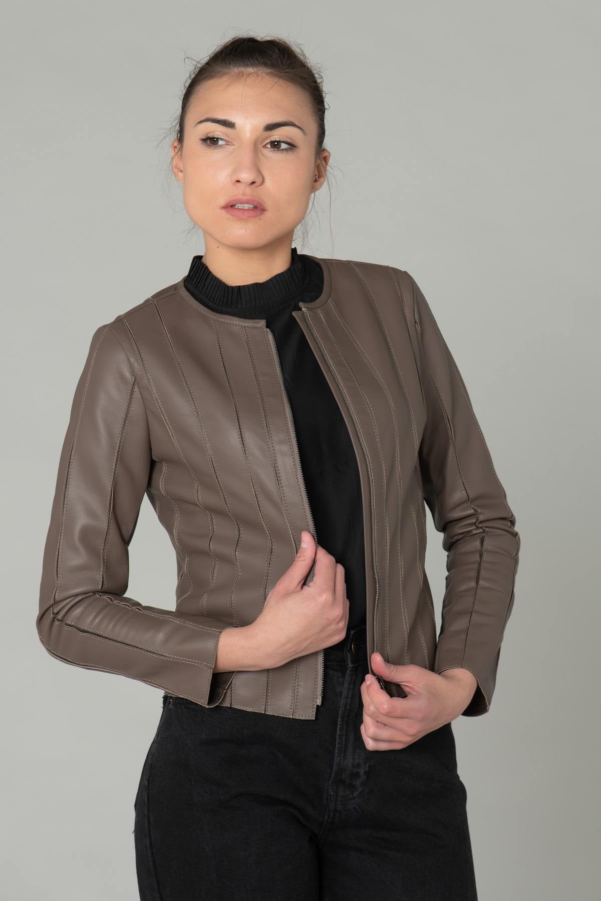 Slim taupe lambskin jacket with textured stitching for urban chic. - Image n°1