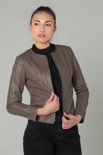 Slim taupe lambskin jacket with textured stitching for urban chic. - Image n°1