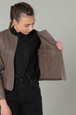 Slim taupe lambskin jacket with textured stitching for urban chic. - Image n°6