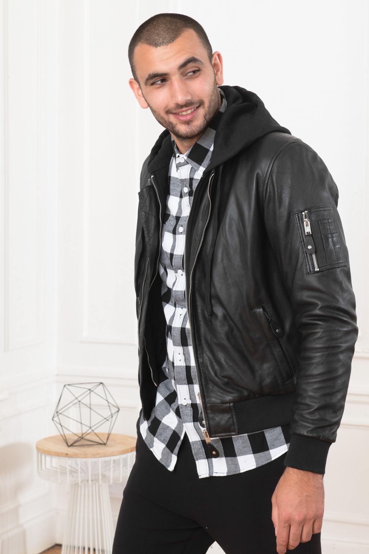 Black lambskin jacket merging bomber and hooded sweatshirt styles. - Image n°1