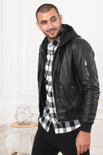 Black lambskin jacket merging bomber and hooded sweatshirt styles. - Image n°1