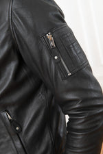 Black lambskin jacket merging bomber and hooded sweatshirt styles. - Image n°2