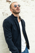 Slim navy suede lambskin jacket with ribbed cuffs and waist for style. - Image n°1