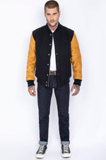 Schott's varsity jacket: navy wool with cognac cowhide sleeves. - Image n°3
