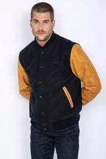 Schott's varsity jacket: navy wool with cognac cowhide sleeves. - Image n°4