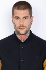 Schott's varsity jacket: navy wool with cognac cowhide sleeves. - Image n°5