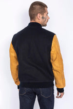 Schott's varsity jacket: navy wool with cognac cowhide sleeves. - Image n°2