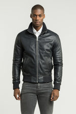 Blue leather jacket with ribbed edges - Image n°1