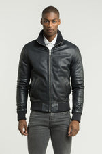 Blue leather jacket with ribbed edges - Image n°1