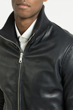 Blue leather jacket with ribbed edges - Image n°5