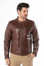 Thick dark cognac cowhide, slim-fit. Zippered pockets for a rugged look. - Image n°1