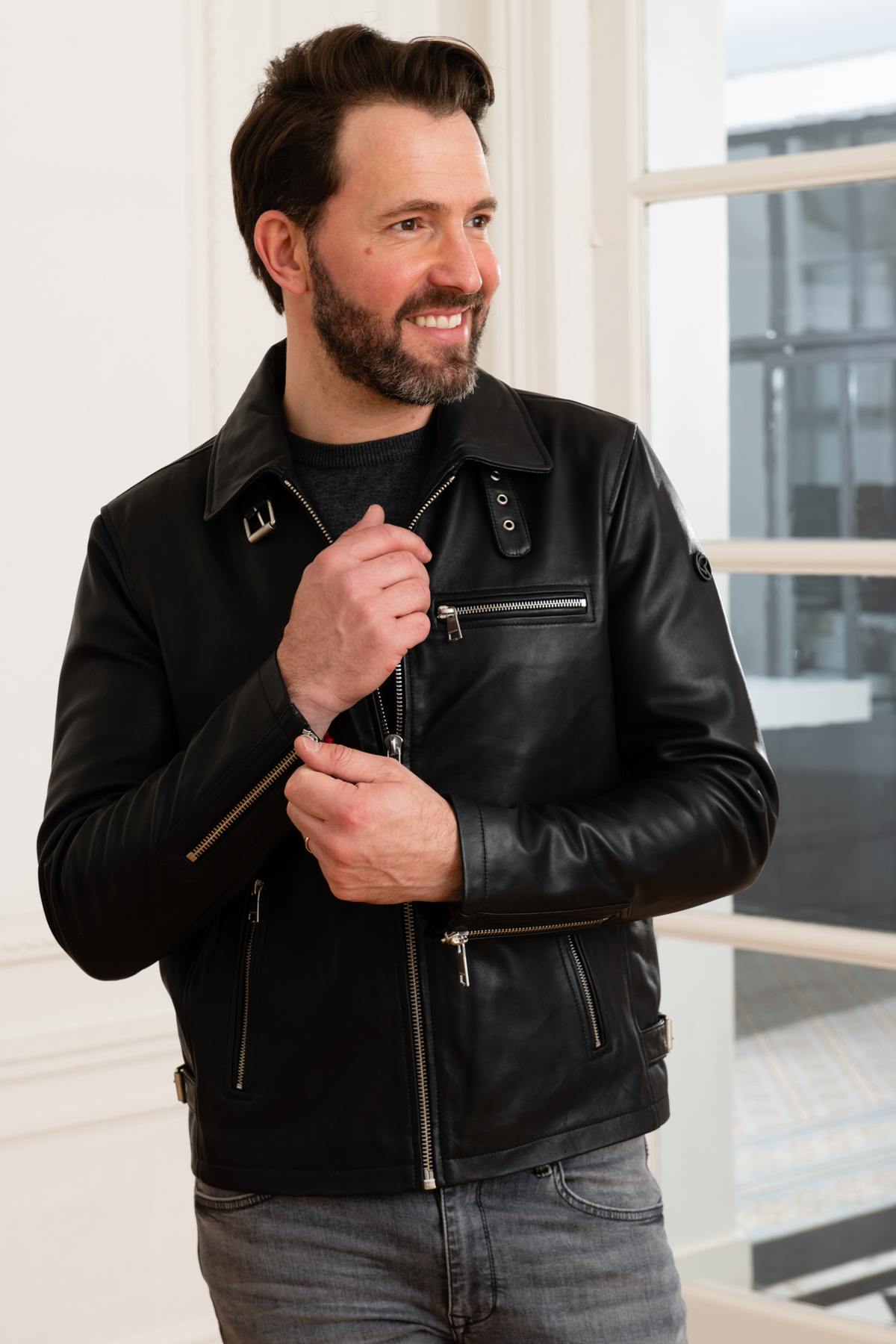 Glossy lambskin biker jacket with adjustable fit for timeless edge. - Image n°1