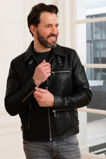 Glossy lambskin biker jacket with adjustable fit for timeless edge. - Image n°1