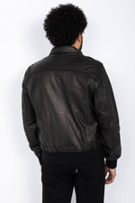 Schott NYC's black goat leather A-2 jacket: a timeless aviator icon. - Image n°5