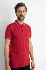 Red polo shirt with striped sleeves and collar - Image n°1
