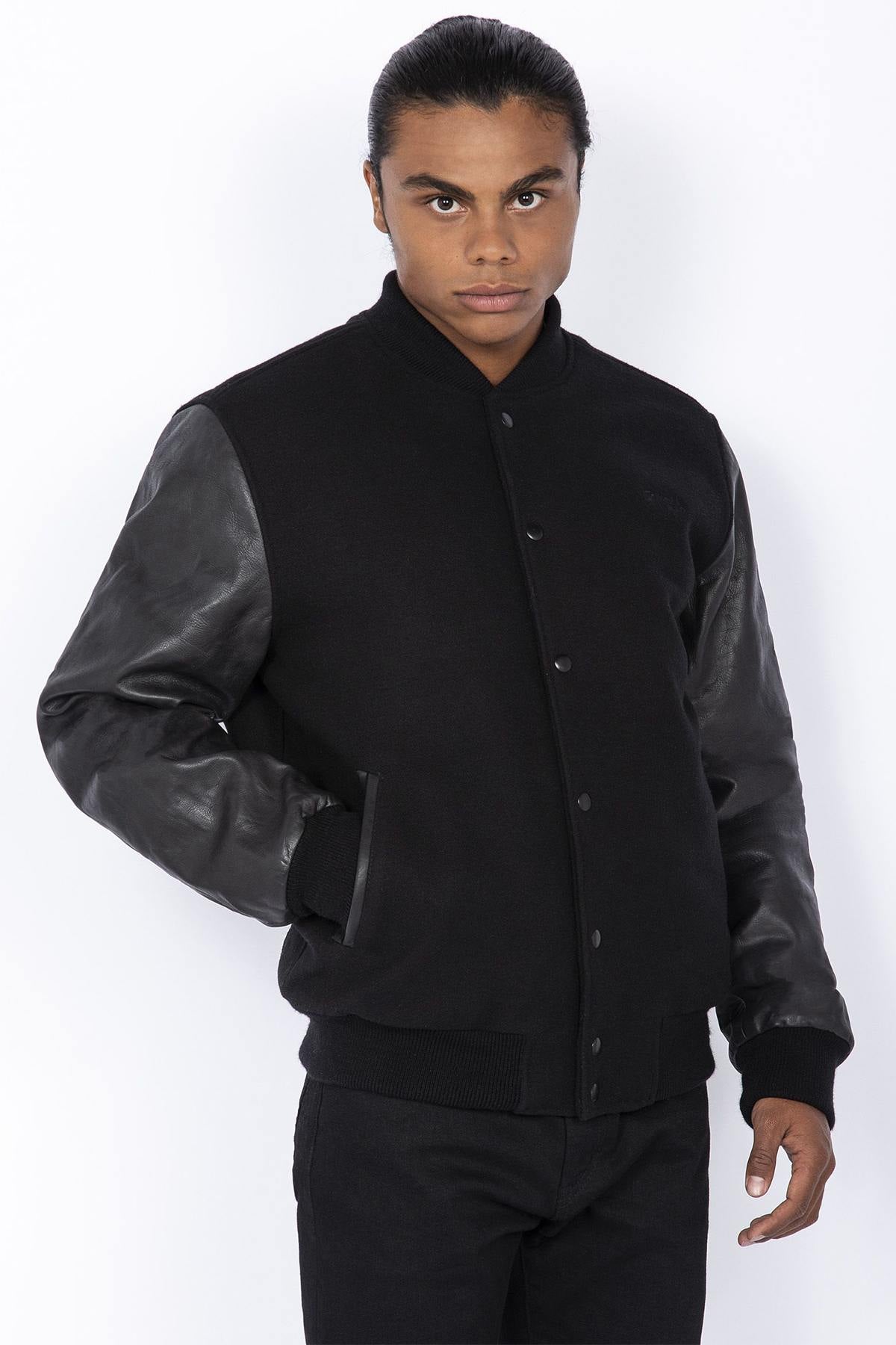 Schott's iconic black varsity jacket blends wool and cowhide leather. - Image n°1