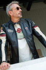 Black sheepskin jacket with racing heritage and luxury finishes. - Image n°1