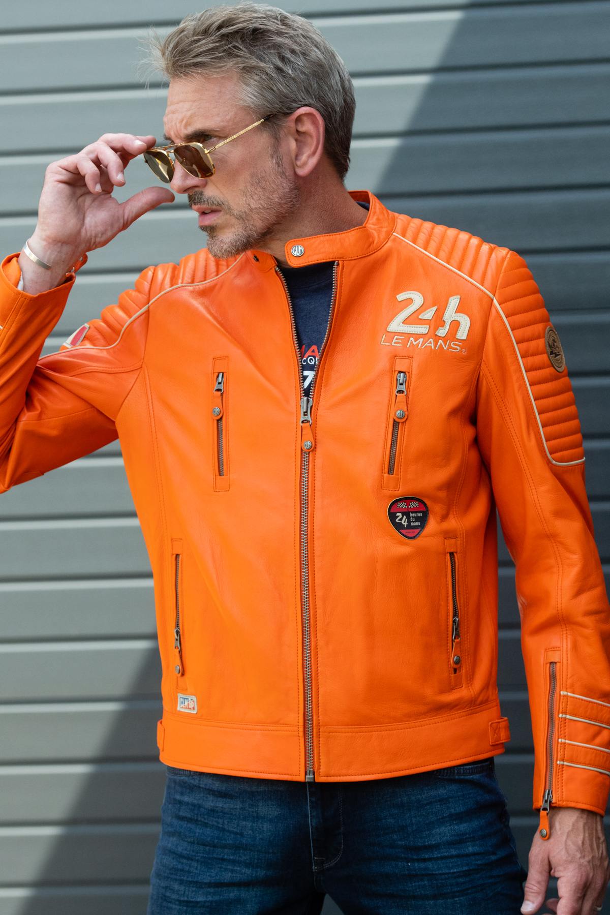 Orange sheepskin leather jacket with quilted shoulders: pure racing style. - Image n°1