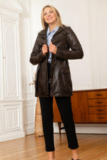 Rich brown lambskin jacket, cinched at the waist for a sleek look. - Image n°1