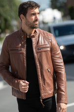 Rich cognac leather jacket, slim fit with quilted detailing for style. - Image n°1