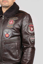 Brown cowhide aviator jacket with vintage patches and epaulettes. - Image n°5
