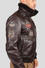 Brown cowhide aviator jacket with vintage patches and epaulettes. - Image n°2