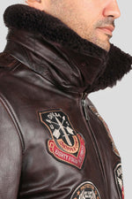 Brown cowhide aviator jacket with vintage patches and epaulettes. - Image n°4