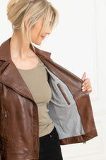 Mid-brown sheepskin biker jacket with vintage patina and adjustable straps. - Image n°7